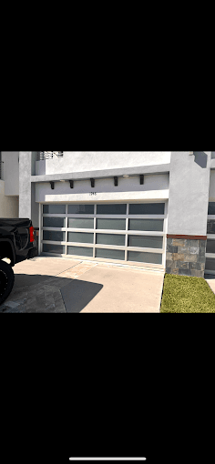 Modern aluminum and glass garage door residential installation